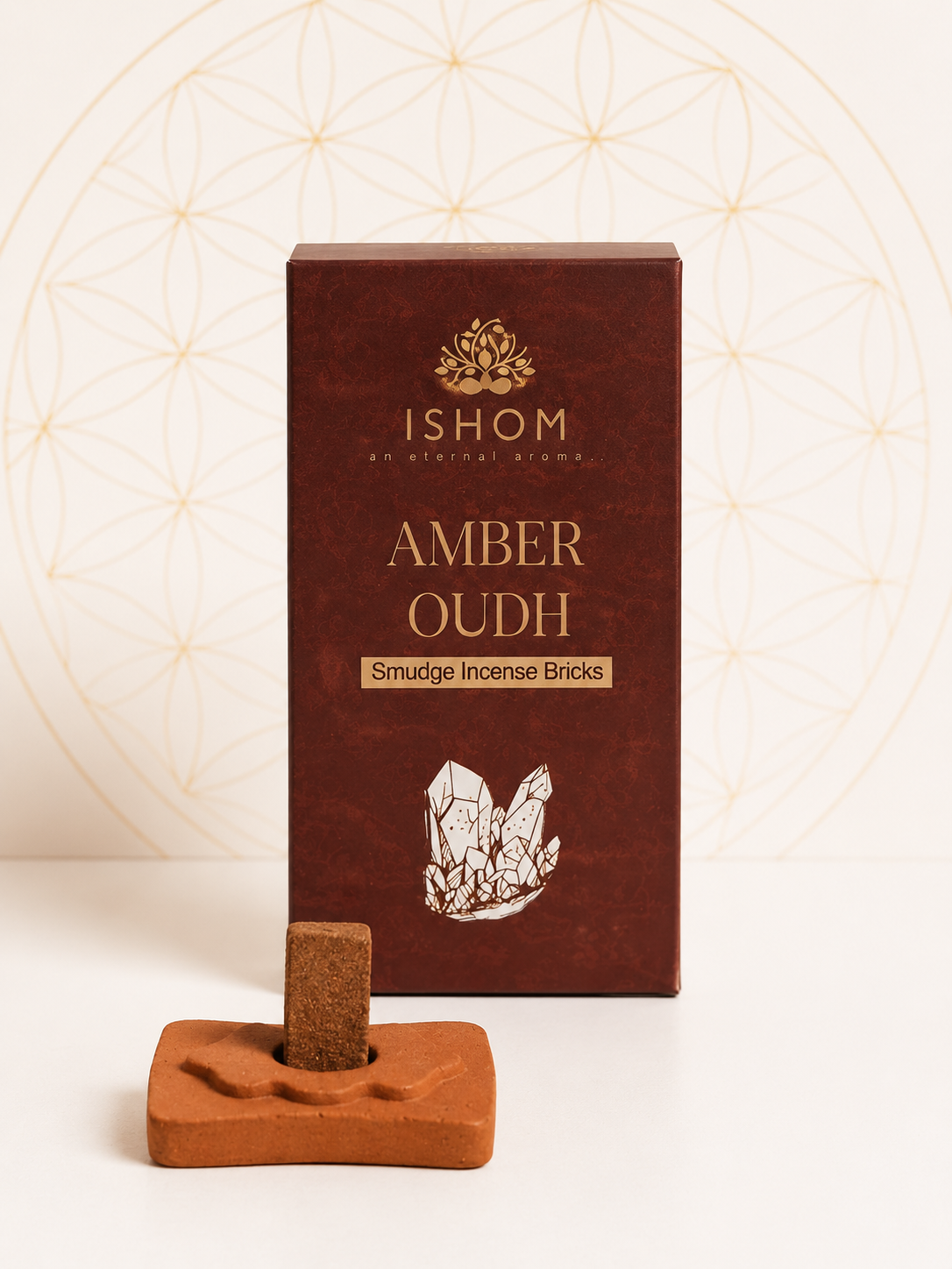 ISHOM Amber Oudh Smudge Incense Bricks with terracotta holder and natural incense bricks displayed on a white background.