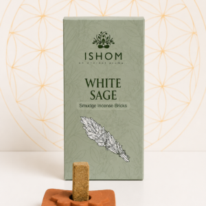 ISHOM White Sage Smudge Incense Bricks with terracotta holder and natural incense bricks displayed on a white table.
