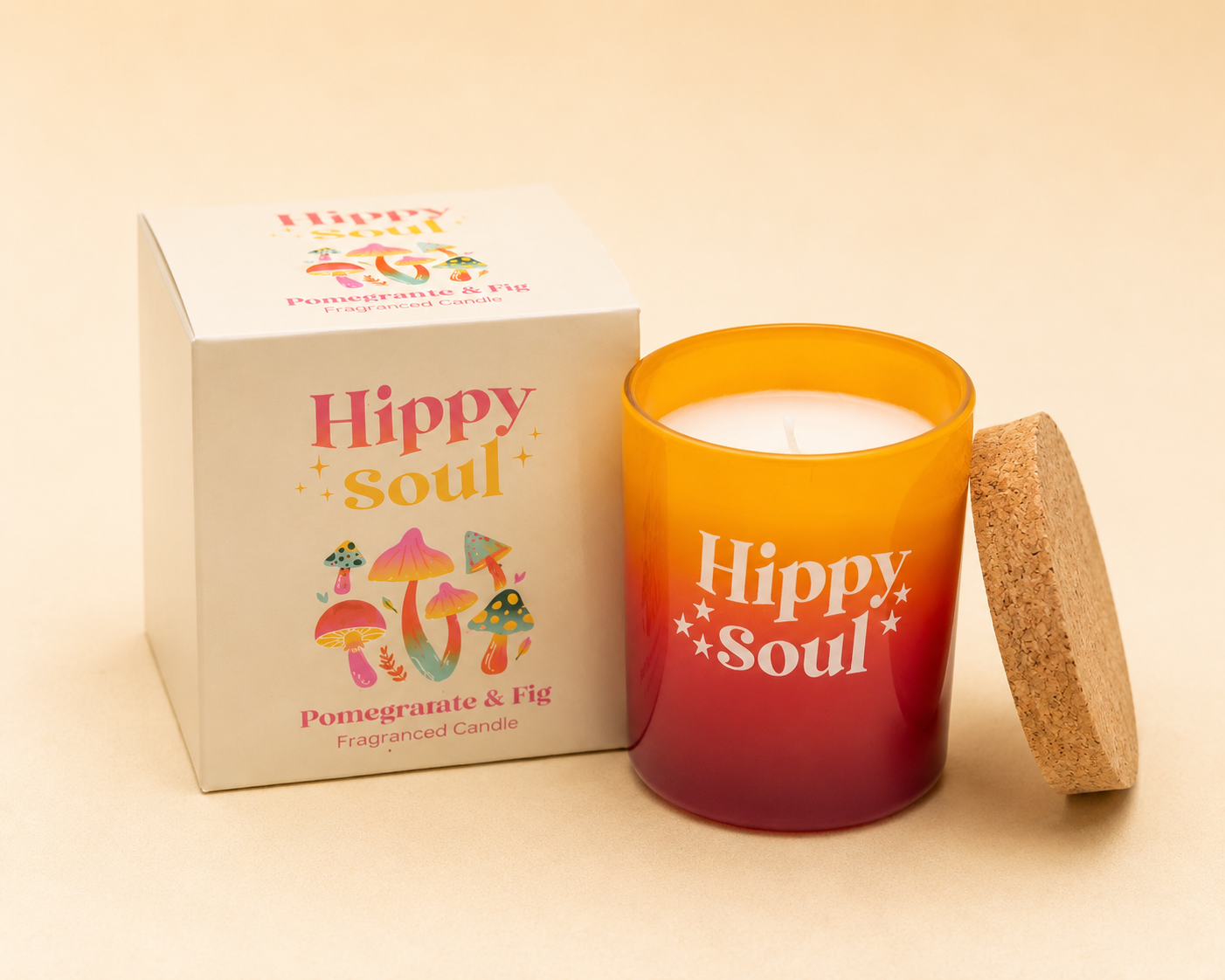 Hippy Soul Pomegranate & Fig scented candle in an orange and red ombre glass jar with cork lid and matching gift box.