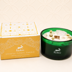 Hop Hare The Lion Crystal Magic Flower Candle with jasmine fragrance and rock quartz crystal in green glass.